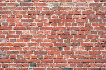 Old red brick wall as background or texture