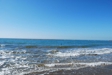 Fototapeta na wymiar Sea waves near the beach
