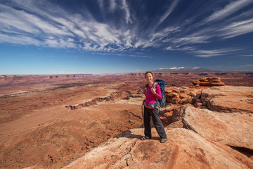 Fototapeta premium Hiker rests in Canyonlands National park in Utah, USA
