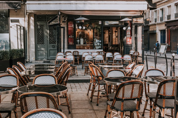 Fototapeta na wymiar  Cafe with tables on street, Paris, France