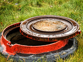 Inverted manhole cover in the rain