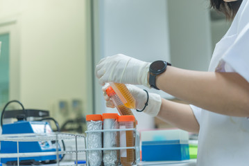 Asian scientist working in the lab,Thailand people,Experiment science and calculate the value,Researchers are research to find the results of the experiment.