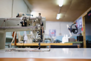 Sewing machine in an original workshop close-up without people