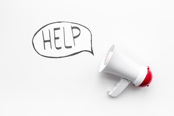 Call for help concept. Megaphone near cloud with word help on white background top view space for text