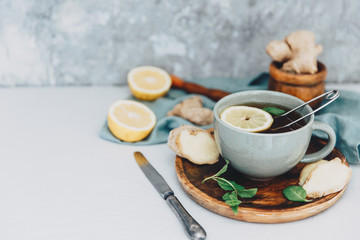 Top view Tea with lemon and ginger on rustic table