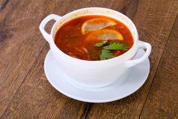 Solyanka soup with lemon