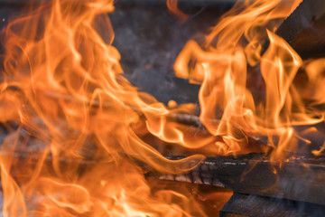 red yellow fire in the fireplace close-up. flames. Fire background. selected focus
