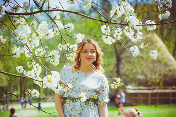 Beautiful pregnant woman in the garden