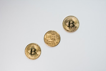 Face and back of the crypto currency golden bitcoin isolated on white background. The concept of virtual international currency and business on the Internet.