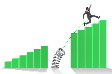 Business people jumping over bar charts