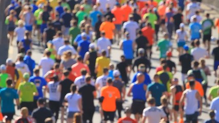 City marathon of blurred on people running