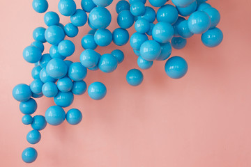 blue balloons, blue bubbles on pink background. Modern punchy pastel colors. Fairy tale cpncept