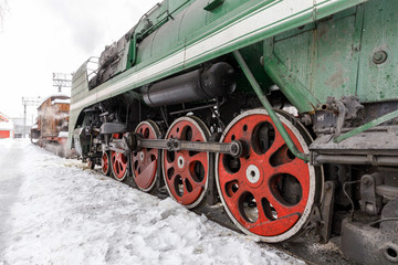 red wheel and detail of mechanism a vintage russian steam train locomotive