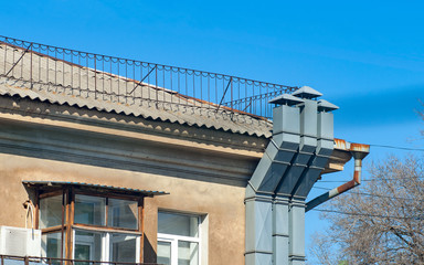 Obraz premium Three modern ventilation pipes on the old wall.