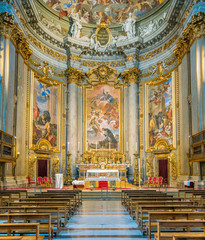 Obraz premium Main altar with scenes from the life of Saint Ignatius by Andrea Pozzo, in the Church of Saint Ignatius of Loyola in Rome, Italy.