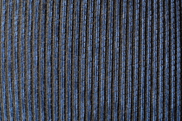 Textiles with vertical blue stripes. Volumetric, natural background. Light on the left.