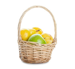 Basket with apples and pears on isolated background