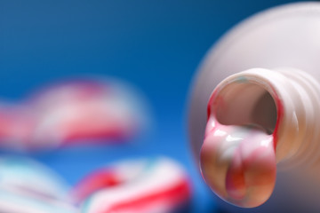 Healthy teeth. Hygiene of the oral cavity. Colored toothpaste from a tube