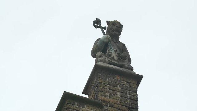 Sculpture on a brick pillar