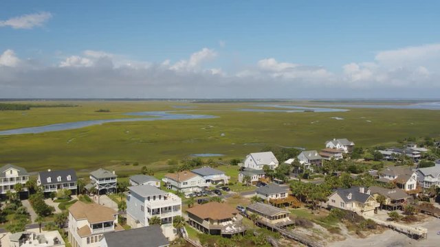 South Carolina Charleston Folly Beach Aerial v50 Panning low to high over Folly Beach neighborhood 10/17