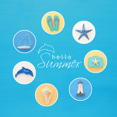 nautical collage with sea life style objects over blue wooden background.