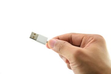  man hand is holding a white USB connector isolated on a white background.