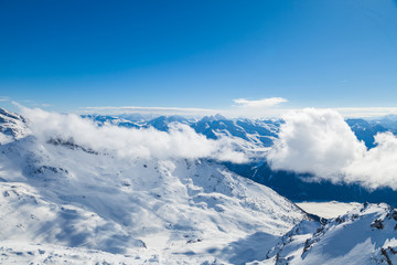 Winter Alps landscape, mountains with clouds, from ski resort Val Thorens. 3 valleys (Les Trois Vallees), France