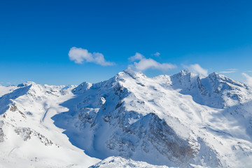 Winter Alps landscape, mountains with clouds, from ski resort Val Thorens. 3 valleys (Les Trois Vallees), France
