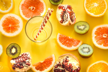 various fruits and a glass with a straw