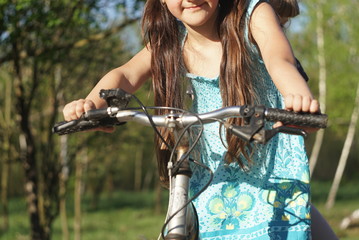 happy little girls on the bike