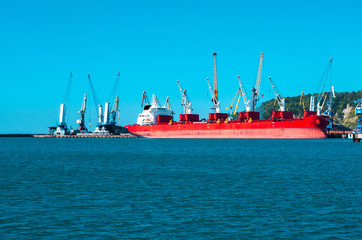 Big red ship on a shipyard background
