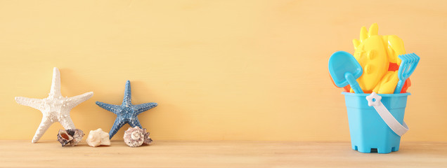 vacation and summer banner with sea life style objects and beach toys for kid. © tomertu