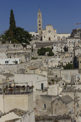 Obraz premium MATERA, ITALY - AUGUST 24 2017: Day view of the historic Sassi district of Matera, with the Cathedral in the background