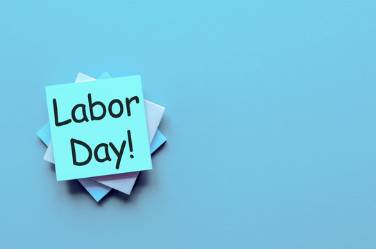 International labor Day at May 1st. Day text on pile of notes with empty space for template. Spring time, labour day - 1 of may, month calendar