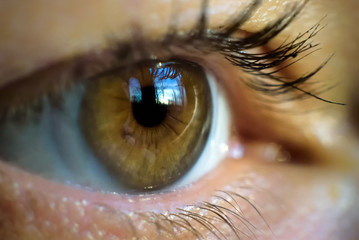 Macro photo of woman's eye with contact lens, human eye close-up