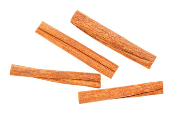 Top view of cinnamon sticks isolated on white background