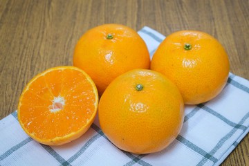 Ripe and Sweet Oranges on A Wooden Table