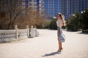 Beautiful girl in spring sunny day outdoors