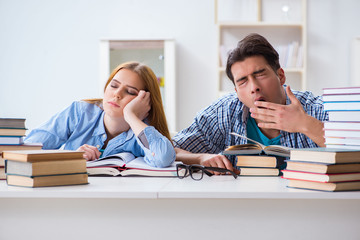 Pair of students studying for university exams