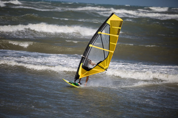 Sea Waves and Wind Surfing in the Summer in Windy Day