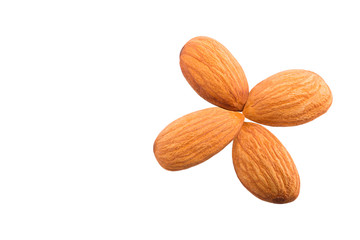 Four whole almonds on white background with copy space