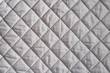 Gray textile diamond pattern. Insulated material.