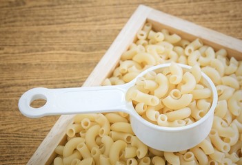 Elbow Macaroni or Gomiti Pasta in Measuring Cup