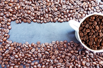 Top view of roasted coffee beans forming a frame or copy space
