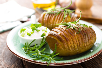 Baked potato. Potato oven baked with garlic and rosemary