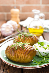 Baked potato. Potato oven baked with garlic and rosemary