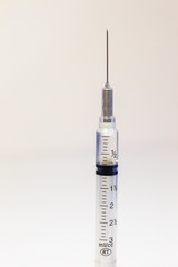 Medical Syringe with an intravenous drug on a white background