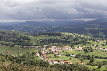 Fototapeta na wymiar village in the valley between the mountains of Cantabria, Spain