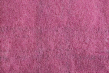 Background of felted natural merino wool close-up