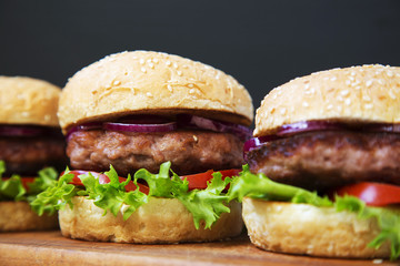 Fresh and delicious home made burgers. Closeup.